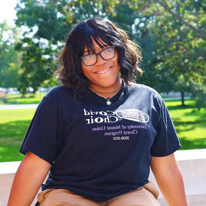 aaliyah kinnard sitting on bench